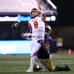 SEATTLE, WASHINGTON - NOVEMBER 28: Jake Bentley #8 of the Utah Utes fumbles the ball while being tackled by Zion Tupuola-Fetui #58 of the Washington Huskies in the first quarter at Husky Stadium on November 28, 2020 in Seattle, Washington. (Photo by Abbie Parr/Getty Images)