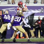 SEATTLE, WASHINGTON - NOVEMBER 28: Jake Bentley #8 of the Utah Utes jumps into the end zone to score a one yard touchdown against the Washington Huskies in the first quarter to take a 7-0 lead at Husky Stadium on November 28, 2020 in Seattle, Washington. (Photo by Abbie Parr/Getty Images)
