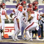 SEATTLE, WASHINGTON - NOVEMBER 28: Jake Bentley #8 of the Utah Utes (middle) celebrates his one yard touchdown run to take a 7-0 lead against the Washington Huskies in the first quarter at Husky Stadium on November 28, 2020 in Seattle, Washington. (Photo by Abbie Parr/Getty Images)