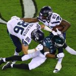 PHILADELPHIA, PENNSYLVANIA - NOVEMBER 30: Rodney McLeod #23 of the Philadelphia Eagles tackles David Moore #83 of the Seattle Seahawks during the first quarter at Lincoln Financial Field on November 30, 2020 in Philadelphia, Pennsylvania. (Photo by Mitchell Leff/Getty Images)