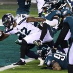 PHILADELPHIA, PENNSYLVANIA - NOVEMBER 30: Chris Carson #32 of the Seattle Seahawks scores a touchdown against Rodney McLeod #23 of the Philadelphia Eagles during the second quarter at Lincoln Financial Field on November 30, 2020 in Philadelphia, Pennsylvania. (Photo by Elsa/Getty Images)