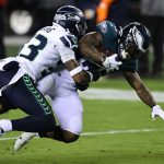 PHILADELPHIA, PENNSYLVANIA - NOVEMBER 30: Miles Sanders #26 of the Philadelphia Eagles carries for a first down as Jamal Adams #33 of the Seattle Seahawks defends during the second quarter at Lincoln Financial Field on November 30, 2020 in Philadelphia, Pennsylvania. (Photo by Elsa/Getty Images)