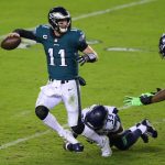 PHILADELPHIA, PENNSYLVANIA - NOVEMBER 30: Carson Wentz #11 of the Philadelphia Eagles is sacked by Jamal Adams #33 of the Seattle Seahawks during the third quarter at Lincoln Financial Field on November 30, 2020 in Philadelphia, Pennsylvania. (Photo by Mitchell Leff/Getty Images)