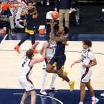 INDIANAPOLIS, INDIANA - DECEMBER 02:  Gabe Osabuohien #3 of the West Virginia Mountaineers shoots the ball against the Gonzaga Bulldogs during the Jimmy V Classic at Bankers Life Fieldhouse on December 02, 2020 in Indianapolis, Indiana. (Photo by Andy Lyons/Getty Images)