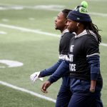 SEATTLE, WASHINGTON - DECEMBER 06: (L-R) Shaquill Griffin #26 and Shaquem Griffin #49 of the Seattle Seahawks walk on the field prior to the game against the New York Giants at Lumen Field on December 06, 2020 in Seattle, Washington. (Photo by Abbie Parr/Getty Images)