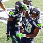 SEATTLE, WASHINGTON - DECEMBER 06: Quandre Diggs #37 of the Seattle Seahawks celebrates his interception with Ugo Amadi #28 against the New York Giants during the first quarter in the game at Lumen Field on December 06, 2020 in Seattle, Washington. (Photo by Abbie Parr/Getty Images)