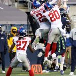 SEATTLE, WASHINGTON - DECEMBER 06: James Bradberry #24 and Julian Love #20 of the New York Giants break up a deep pass thrown by Russell Wilson #3 of the Seattle Seahawks during the fourth quarter in the game at Lumen Field on December 06, 2020 in Seattle, Washington. (Photo by Abbie Parr/Getty Images)