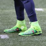 SEATTLE, WASHINGTON - DECEMBER 06: A general view of the cleats worn by Russell Wilson #3 of the Seattle Seahawks with the faces of Charleena Lyles and George Floyd before their game against the New York Giants  at Lumen Field on December 06, 2020 in Seattle, Washington. (Photo by Abbie Parr/Getty Images)