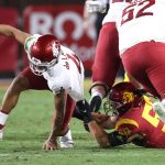 LOS ANGELES, CALIFORNIA - DECEMBER 06: Nick Figueroa #50 of the USC Trojans sacks Jayden de Laura #4 of the Washington State Cougars during the first half of a game at Los Angeles Coliseum on December 06, 2020 in Los Angeles, California. (Photo by Sean M. Haffey/Getty Images)
