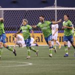 SEATTLE, WASHINGTON - DECEMBER 07: Gustav Svensson (2L) #4 of Seattle Sounders celebrates his goal in the 93rd minute against Minnesota United during their Western Conference Finals game at Lumen Field on December 07, 2020 in Seattle, Washington. The Sounders took a 3-2 lead on the play. (Photo by Abbie Parr/Getty Images)