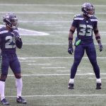 SEATTLE, WASHINGTON - DECEMBER 13: D.J. Reed #29 and Jamal Adams #33 of the Seattle Seahawks looks on against the New York Jets during the first quarter in the game at Lumen Field on December 13, 2020 in Seattle, Washington. (Photo by Abbie Parr/Getty Images)