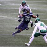 SEATTLE, WASHINGTON - DECEMBER 13: Carlos Hyde #30 of the Seattle Seahawks runs the ball against Matthias Farley #41 of the New York Jets during the first quarter in the game at Lumen Field on December 13, 2020 in Seattle, Washington. (Photo by Abbie Parr/Getty Images)