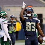 SEATTLE, WASHINGTON - DECEMBER 13: David Moore #83 of the Seattle Seahawks celebrates after scoring a 3 yard touchdown against the New York Jets during the third quarter in the game at Lumen Field on December 13, 2020 in Seattle, Washington. (Photo by Abbie Parr/Getty Images)