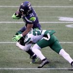 SEATTLE, WASHINGTON - DECEMBER 13: Arthur Maulet #23 of the New York Jets tackles DeeJay Dallas #31 of the Seattle Seahawks during the fourth quarter in the game at Lumen Field on December 13, 2020 in Seattle, Washington. (Photo by Abbie Parr/Getty Images)