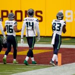 LANDOVER, MARYLAND - DECEMBER 20: Freddie Swain #18, Tyler Lockett #16,  DK Metcalf #14, and David Moore #83 of the Seattle Seahawks warm up before the start of their game against the Washington Football Team at FedExField on December 20, 2020 in Landover, Maryland. (Photo by Tim Nwachukwu/Getty Images)