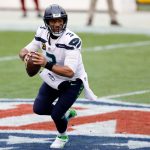 LANDOVER, MARYLAND - DECEMBER 20: Quarterback Russell Wilson #3 of the Seattle Seahawks rolls out to pass in the first quarter against the Washington Football Team at FedExField on December 20, 2020 in Landover, Maryland. (Photo by Tim Nwachukwu/Getty Images)