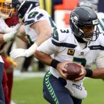 LANDOVER, MARYLAND - DECEMBER 20: Quarterback Russell Wilson #3 of the Seattle Seahawks looks to hand the ball off in the first half against the Washington Football Team at FedExField on December 20, 2020 in Landover, Maryland. (Photo by Patrick Smith/Getty Images)
