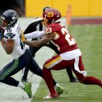 LANDOVER, MARYLAND - DECEMBER 20: Wide receiver Tyler Lockett #16 of the Seattle Seahawks is shoved out of bounds after making a first half catch by cornerback Ronald Darby #23 of the Washington Football Team at FedExField on December 20, 2020 in Landover, Maryland. (Photo by Patrick Smith/Getty Images)