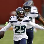 LANDOVER, MARYLAND - DECEMBER 20: Free safety D.J. Reed #29 of the Seattle Seahawks celebrates after intercepting a Washington Football Team pass in the second half at FedExField on December 20, 2020 in Landover, Maryland. (Photo by Tim Nwachukwu/Getty Images)
