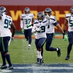 LANDOVER, MARYLAND - DECEMBER 20: Free safety D.J. Reed #29 of the Seattle Seahawks celebrates after intercepting a Washington Football Team pass in the second half at FedExField on December 20, 2020 in Landover, Maryland. (Photo by Tim Nwachukwu/Getty Images)
