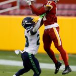 LANDOVER, MARYLAND - DECEMBER 20: Wide receiver Terry McLaurin #17 of the Washington Football Team catches a pass in front of safety Ugo Amadi #28 of the Seattle Seahawks in the second half at FedExField on December 20, 2020 in Landover, Maryland. (Photo by Tim Nwachukwu/Getty Images)