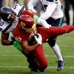 LANDOVER, MARYLAND - DECEMBER 20: Outside linebacker K.J. Wright #50 of the Seattle Seahawks tackles tight end Logan Thomas #82 of the Washington Football Team in the second half at FedExField on December 20, 2020 in Landover, Maryland. (Photo by Tim Nwachukwu/Getty Images)