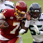 LANDOVER, MARYLAND - DECEMBER 20: Linebacker Ben Burr-Kirven #55 of the Seattle Seahawks knocks quarterback Dwayne Haskins #7 of the Washington Football Team out of bounds in the second half at FedExField on December 20, 2020 in Landover, Maryland. (Photo by Patrick Smith/Getty Images)