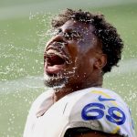SEATTLE, WASHINGTON - DECEMBER 27: Sebastian Joseph-Day #69 of the Los Angeles Rams douses his face with water before the game against the Seattle Seahawks at Lumen Field on December 27, 2020 in Seattle, Washington. (Photo by Abbie Parr/Getty Images)