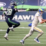 SEATTLE, WASHINGTON - DECEMBER 27: Ugo Amadi #28 of the Seattle Seahawks pressures Jared Goff #16 of the Los Angeles Rams during the first quarter at Lumen Field on December 27, 2020 in Seattle, Washington. (Photo by Abbie Parr/Getty Images)