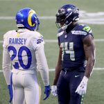 SEATTLE, WASHINGTON - DECEMBER 27: Jalen Ramsey #20 of the Los Angeles Rams and DK Metcalf #14 talk during the fourth quarter of the Seattle Seahawks at Lumen Field on December 27, 2020 in Seattle, Washington. (Photo by Abbie Parr/Getty Images)