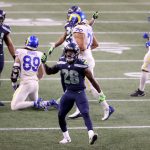 SEATTLE, WASHINGTON - DECEMBER 27: Ugo Amadi #28 of the Seattle Seahawks celebrates after a stop against the Los Angeles Rams during the fourth quarter at Lumen Field on December 27, 2020 in Seattle, Washington. (Photo by Abbie Parr/Getty Images)