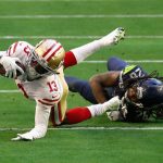 GLENDALE, ARIZONA - JANUARY 03: Wide receiver Richie James #13 of the San Francisco 49ers makes a reception past cornerback Shaquill Griffin #26 of the Seattle Seahawks during the first half of the NFL game at State Farm Stadium on January 03, 2021 in Glendale, Arizona. (Photo by Christian Petersen/Getty Images)