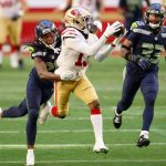 GLENDALE, ARIZONA - JANUARY 03: Wide receiver Richie James #13 of the San Francisco 49ers makes a 40-yard reception past Shaquill Griffin #26 and Jamal Adams #33 of the Seattle Seahawks during the first half of the NFL game at State Farm Stadium on January 03, 2021 in Glendale, Arizona. (Photo by Christian Petersen/Getty Images)