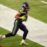 GLENDALE, ARIZONA - JANUARY 03: Wide receiver Tyler Lockett #16 of the Seattle Seahawks catches a 4-yard touchdown reception against the San Francisco 49ers during the second half of the NFL game at State Farm Stadium on January 03, 2021 in Glendale, Arizona. (Photo by Christian Petersen/Getty Images)