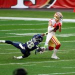 GLENDALE, ARIZONA - JANUARY 03: Safety Ugo Amadi #28 of the Seattle Seahawks tackles wide receiver River Cracraft #86 of the San Francisco 49ers during the fourth quarter at State Farm Stadium on January 03, 2021 in Glendale, Arizona. (Photo by Chris Coduto/Getty Images)