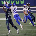 SEATTLE, WASHINGTON - JANUARY 09: Cornerback Jalen Ramsey #20 of the Los Angeles Rams breaks up a pass intended for wide receiver DK Metcalf #14 of the Seattle Seahawks during the NFC Wild Card Playoff game at Lumen Field on January 09, 2021 in Seattle, Washington. (Photo by Steph Chambers/Getty Images)