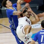 INDIANAPOLIS, IN - MARCH 28: Christian Bishop #13 of the Creighton Bluejays competes for a loose ball with Anton Watson #22 of the Gonzaga Bulldogs during the first half at Hinkle Fieldhouse on March 28, 2021 in Indianapolis, Indiana. (Photo by Michael Hickey/Getty Images)