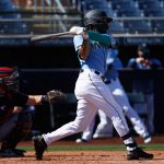 PEORIA, ARIZONA - MARCH 02: J.P. Crawford #3 of the Seattle Mariners hits a single against the Cleveland Indians during the first inning of the MLB spring training game on March 02, 2021 in Peoria, Arizona.  The Indians defeated the Mariners 6-1.  (Photo by Christian Petersen/Getty Images)