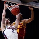 INDIANAPOLIS, INDIANA - MARCH 30: Drew Timme #2 of the Gonzaga Bulldogs dunks the ball against Evan Mobley #4 of the USC Trojans during the first half in the Elite Eight round game of the 2021 NCAA Men's Basketball Tournament at Lucas Oil Stadium on March 30, 2021 in Indianapolis, Indiana. (Photo by Jamie Squire/Getty Images)
