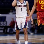 INDIANAPOLIS, INDIANA - MARCH 30: Jalen Suggs #1 of the Gonzaga Bulldogs celebrates a three point basket during the first half against the USC Trojans in the Elite Eight round game of the 2021 NCAA Men's Basketball Tournament at Lucas Oil Stadium on March 30, 2021 in Indianapolis, Indiana. (Photo by Jamie Squire/Getty Images)