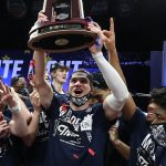 INDIANAPOLIS, INDIANA - MARCH 30: Corey Kispert #24 of the Gonzaga Bulldogs celebrates with the West Regional Champion trophy after defeating the USC Trojans 85-66 in the Elite Eight round game of the 2021 NCAA Men's Basketball Tournament at Lucas Oil Stadium on March 30, 2021 in Indianapolis, Indiana. (Photo by Jamie Squire/Getty Images)