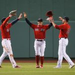BOSTON, MA - APRIL 23: Alex Verdugo #99, Kiké Hernandez #6, and Hunter Renfroe #99 of the Boston Red Sox celebrate after beating the Seattle Mariners at Fenway Park on April 23, 2021 in Boston, Massachusetts. (Photo by Kathryn Riley/Getty Images)
