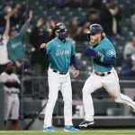 SEATTLE, WASHINGTON - APRIL 02: Jake Fraley #28 of the Seattle Mariners scores against the San Francisco Giants in the second inning at T-Mobile Park on April 02, 2021 in Seattle, Washington. (Photo by Steph Chambers/Getty Images)