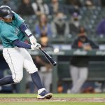 SEATTLE, WASHINGTON - APRIL 02: Luis Torrens #22 of the Seattle Mariners hits a double to score Jake Fraley #28 against the San Francisco Giants in the second inning at T-Mobile Park on April 02, 2021 in Seattle, Washington. (Photo by Steph Chambers/Getty Images)
