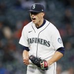 SEATTLE, WASHINGTON - APRIL 03: Chris Flexen #77 of the Seattle Mariners reacts after a strike out against the San Francisco Giants in the fourth inning at T-Mobile Park on April 03, 2021 in Seattle, Washington. (Photo by Steph Chambers/Getty Images)