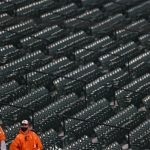 BALTIMORE, MARYLAND - APRIL 12: Fans wear rain ponchos as the game between the Seattle Mariners and Baltimore Orioles is delayed by inclement weather at Oriole Park at Camden Yards on April 12, 2021 in Baltimore, Maryland. (Photo by Patrick Smith/Getty Images)