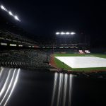 BALTIMORE, MARYLAND - APRIL 12: The infield is seen covered as the game between the Seattle Mariners and Baltimore Orioles is delayed by inclement weather at Oriole Park at Camden Yards on April 12, 2021 in Baltimore, Maryland. (Photo by Patrick Smith/Getty Images)
