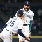 SEATTLE, WASHINGTON - APRIL 19: J.P. Crawford #3 celebrates an out made by Dylan Moore #25 of the Seattle Mariners to end the top of the seventh inning against the Los Angeles Dodgers T-Mobile Park on April 19, 2021 in Seattle, Washington. (Photo by Abbie Parr/Getty Images)2