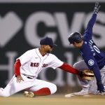 BOSTON, MASSACHUSETTS - APRIL 22: Sam Haggerty #0 of the Seattle Mariners steals second past Xander Bogaerts #2 of the Boston Red Sox during the eighth inning at Fenway Park on April 22, 2021 in Boston, Massachusetts. (Photo by Maddie Meyer/Getty Images)