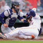 HOUSTON, TEXAS - APRIL 26: Yordan Alvarez #44 of the Houston Astros slides safely into home base ahead of the tag from Luis Torrens #22 of the Seattle Mariners during the first inning at Minute Maid Park on April 26, 2021 in Houston, Texas. (Photo by Carmen Mandato/Getty Images)